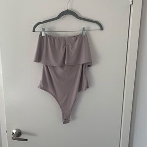 Pale pink strapless bodysuit